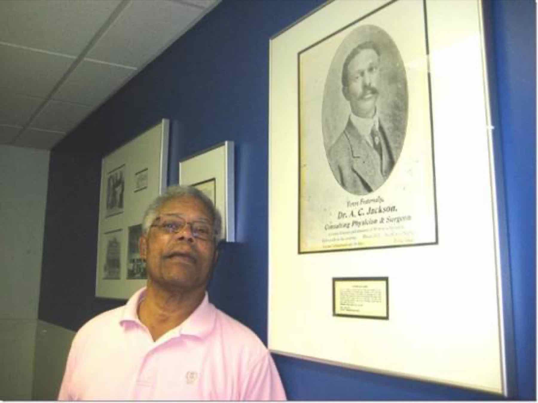 The Dr. A. C. Jackson fraternal card portrait, framed and displayed as part of a memorial wall of Jackson family documents and photographs