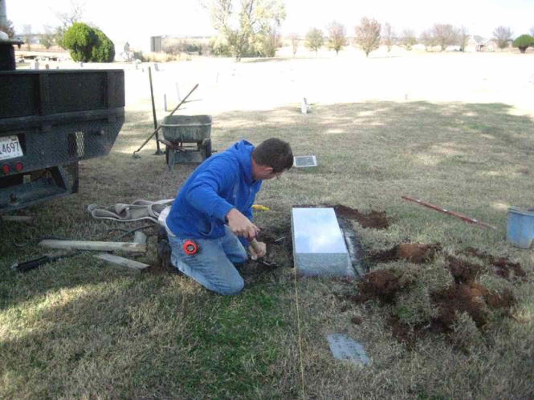 Setting the base at the previously unmarked gravesite — for 92 years Dr. Jackson's grave carried no marker